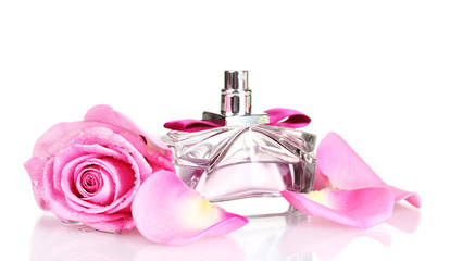 Perfume and pink roses on white background
