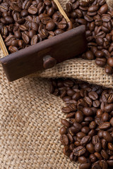Coffee beans in drawer on burlap fabric