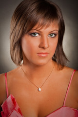 portrait of a young woman in a pink dress