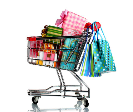 shopping cart with bright gifts and paper bags isolated