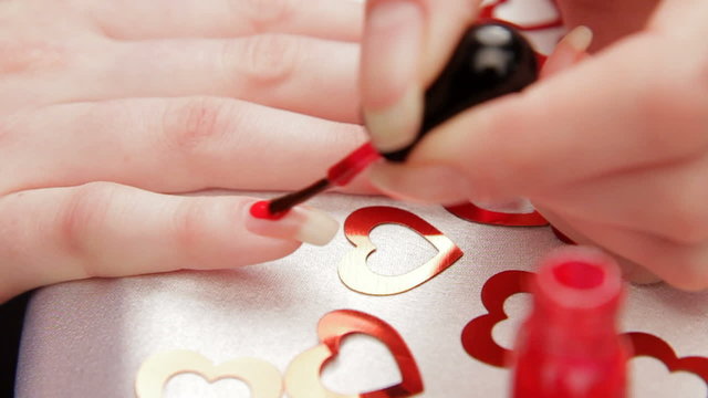 Woman paints the nails