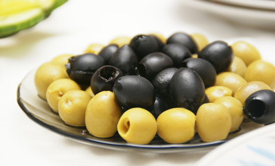 Olives are accurately laid on a plate