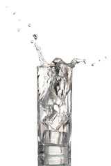 fresh water in glass with ice cubes isolated on white
