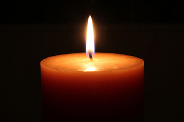 Candle on a black background