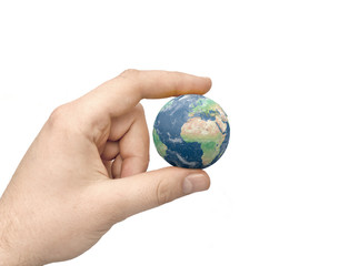 Hand holds detailed earth globe. Isolated on a white background.