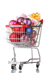 Beautiful bright Christmas balls and gifts in the cart isolated