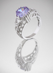 Ring with blue gem on grey