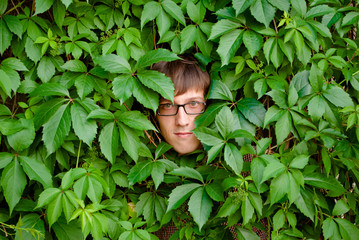Face among ivy.