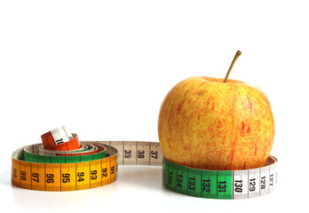 Apple with measuring tape