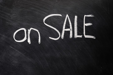 Fototapeta premium On sale written on blackboard