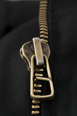 Closed yellow metal zipper