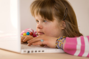 A girl using a laptop.