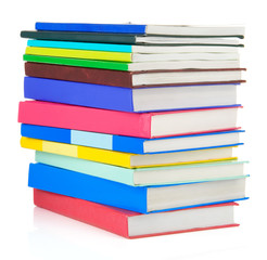 pile of new books isolated on white