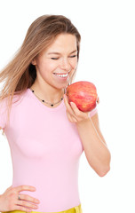 Young happy woman with closed eyes holding apple