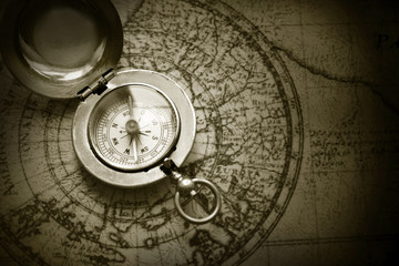 old compass on vintage map