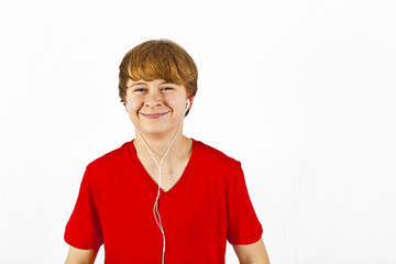 happy boy listening to music via earphone