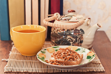 Breakfast. Teapot, cup and sandwich