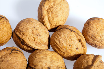 Close up of many scattered walnuts. Background.