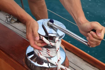Velvet curtains Sailing winch on a sailboat