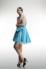 portrait of a beautiful women with perfect skin in a dress