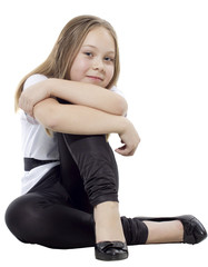Fototapeta premium The lovely girl sits in black shoes