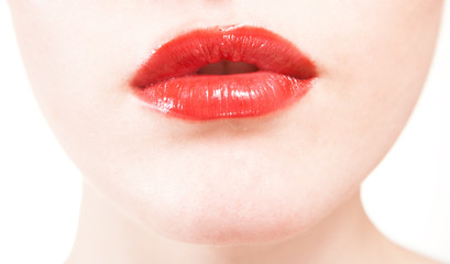 Fototapeta premium closeup of beautiful red lips on white background
