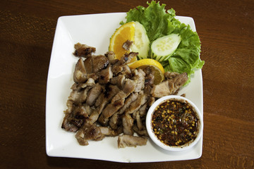 Thai style grilled pork with spicy sauce
