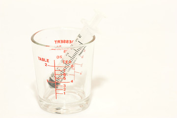 Glass measuring cup isolated on white background .