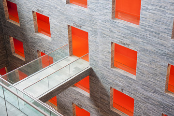 Futuristic interior with big orange rooms in a modern building