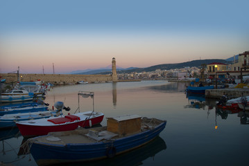 Fototapeta premium Sunset over the Venetian Harbour at Rethymno Crete Greece