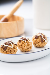 Three chocolate covered treats.