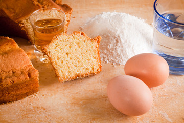 Slices of Cake with Raw Ingredients and Dessert Wine Glass