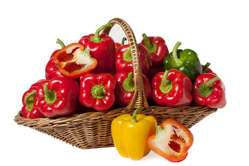 basket full of fresh bell peppers isolated on white