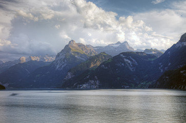 Picturesque swiss lake and alps before sunset, Switzerland, Euro