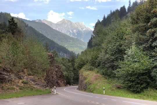 Swiss Alps road Switzerland mountain forest nature scenery travel adventure landcape journey