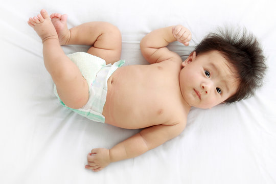 top view portrait of baby on bed