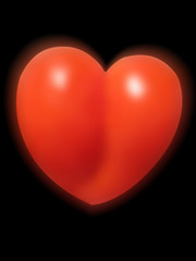 red shining heart over black