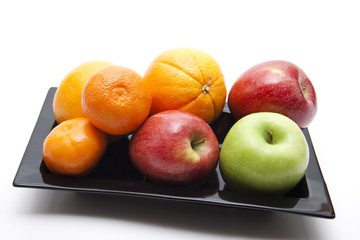 Obst auf schwarzen Teller