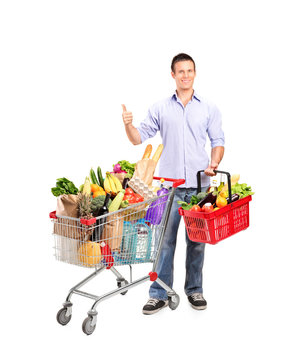 Man giving thumb up and shopping basket and cart