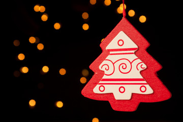 Red Christmas Tree against Light Bokeh Background