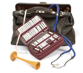 many homeopathic globule with other midwife equipment