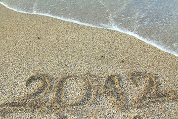2012 new year message on the sand beach