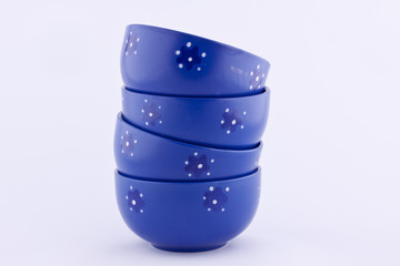 stack of blue bowls