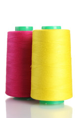 Bobbins of thread isolated on white