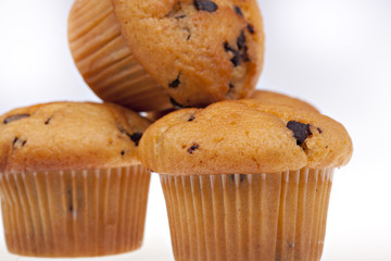 Three chocolate muffins isolated on a white