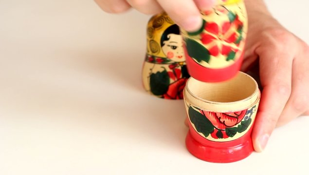 Matrioshka dolls placed in row and taken apart. HD H.264
