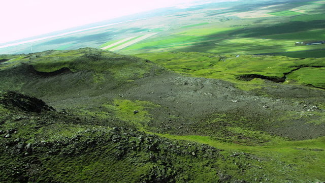 Aerial View of Rugged Icelandic Volcanic Ridges & Grasslands