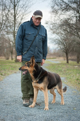 Smart German Shepherd dog/Alsatian and his master
