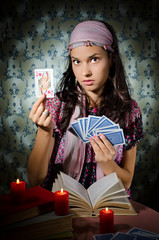 Fortune-teller predicing the cards
