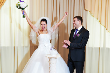 Funny bride and groom in delight
